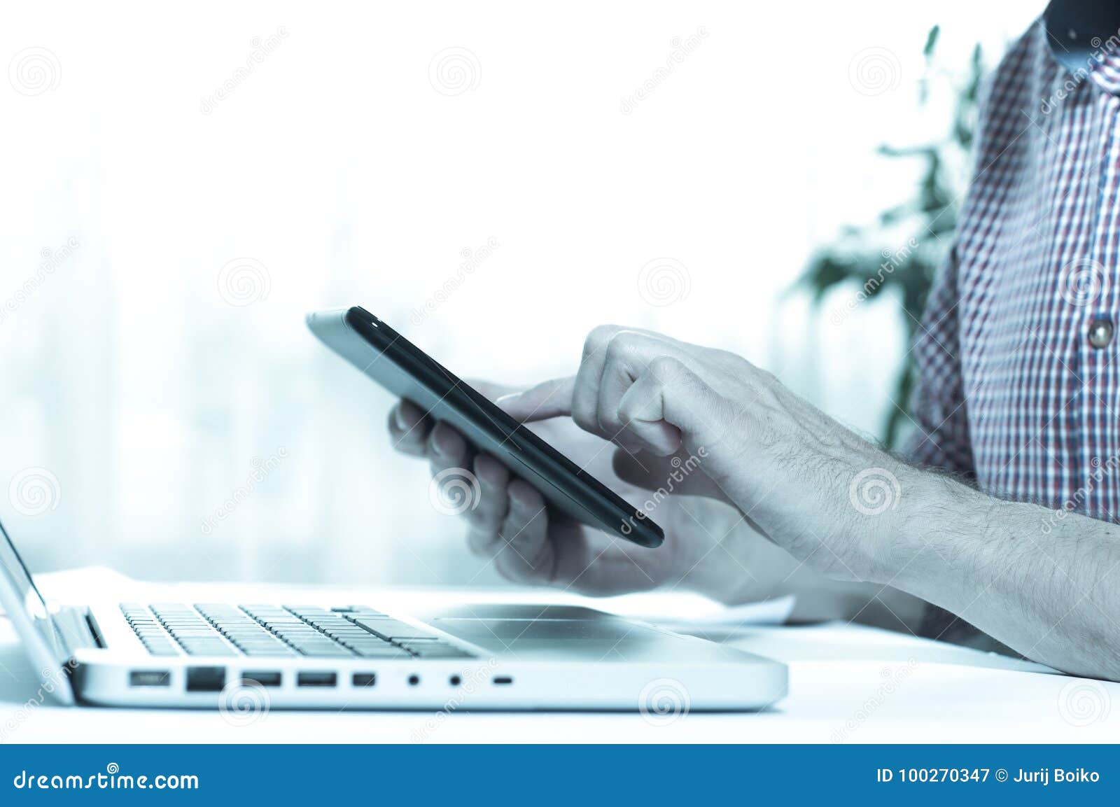 Elegant Business Multitasking Multimedia Man Using Devices at Home