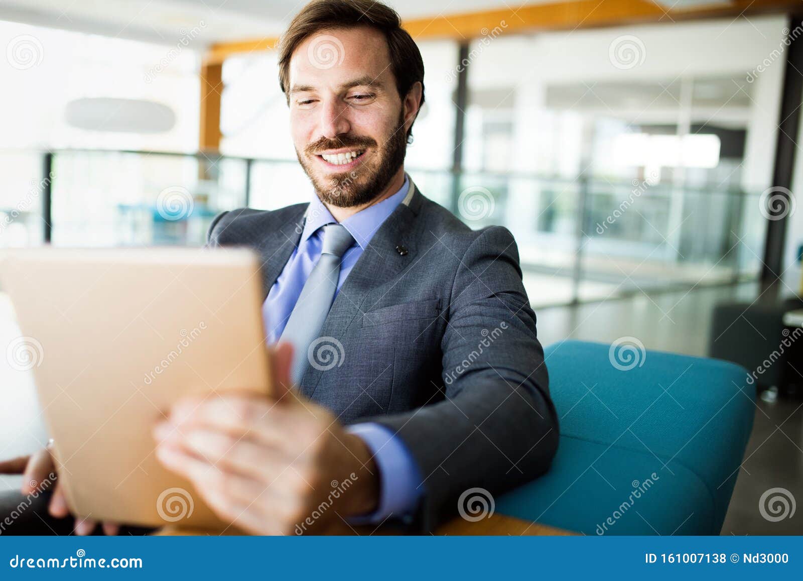 Elegant Business Multitasking Multimedia Man Using Devices Stock Photo