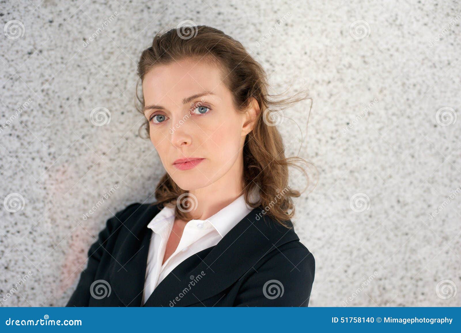 elegant business woman with serious expression on face