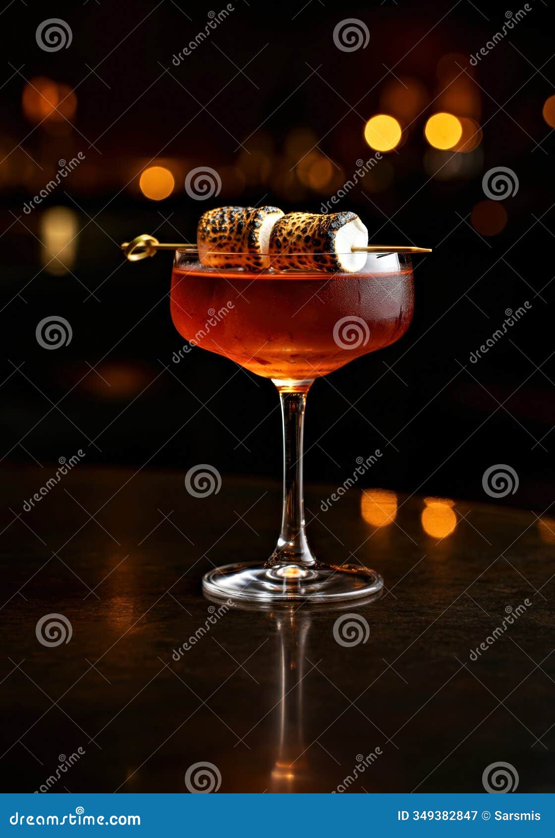 elegant cocktail with toasted marshmallow garnish in dimly lit bar setting