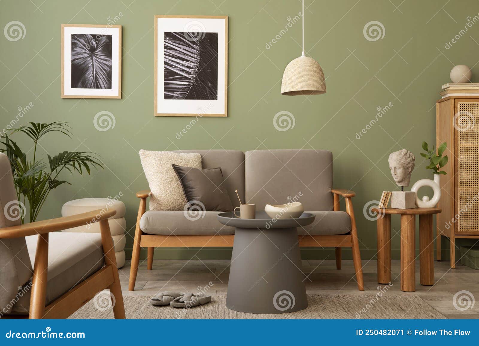 elegant composition of living room interior. modern scandi sofa, side table, rattan commode, plants and creative personal