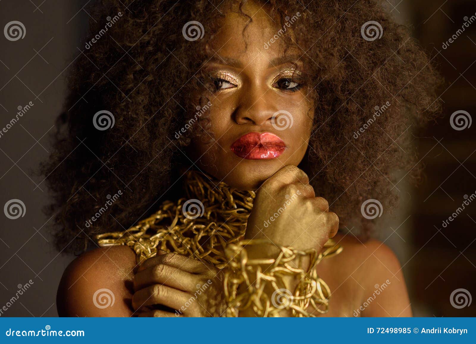 Elegant Exotic African American Woman with a Curly Afro Hairstyle Wearing Gold Makeup and Necklace Looking Away Stock Image - Image of afro, eyes: 72498985 Elegant Exotic African American Woman with a Curly Afro Hairstyle Wearing Gold Makeup and Necklace Looking Away Stock Image - Image of afro, eyes: 72498985