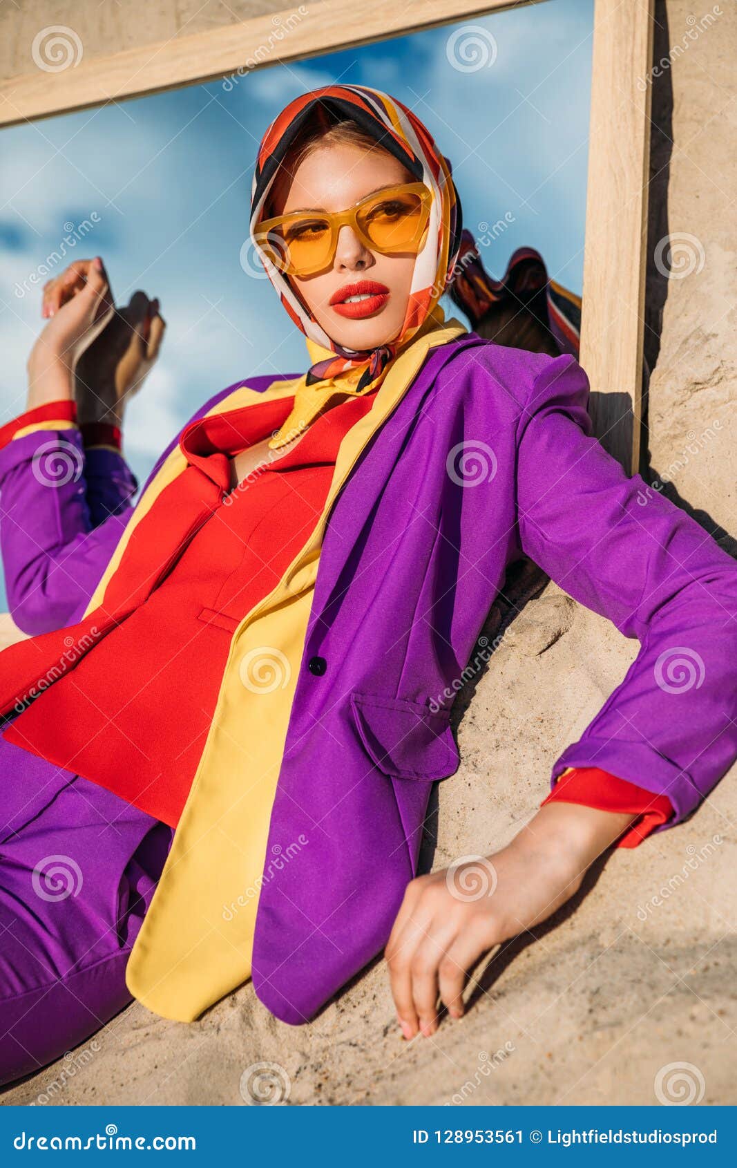 elegant fashionable lady posing on mirror