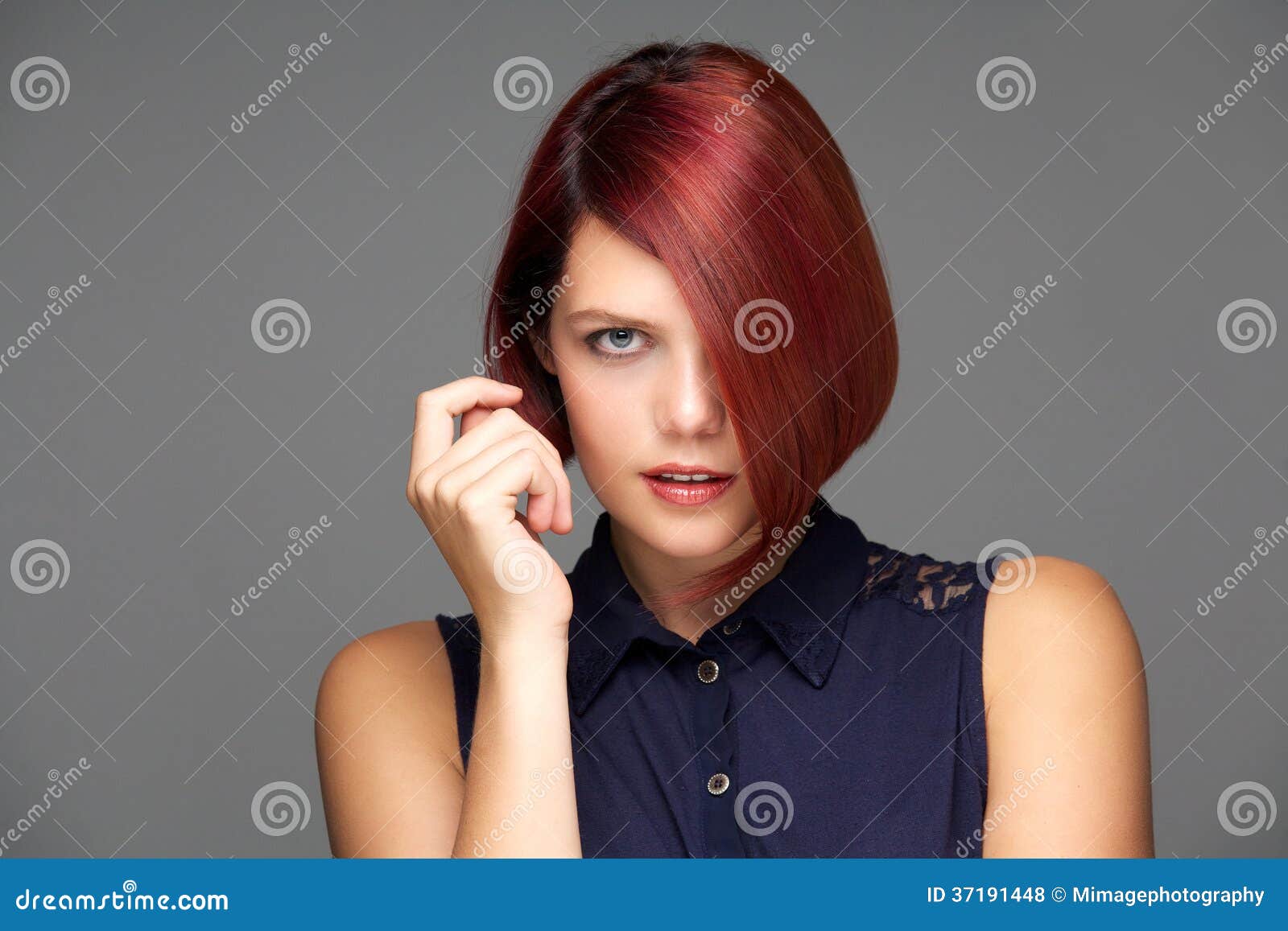 elegant female fashion model with short red hair