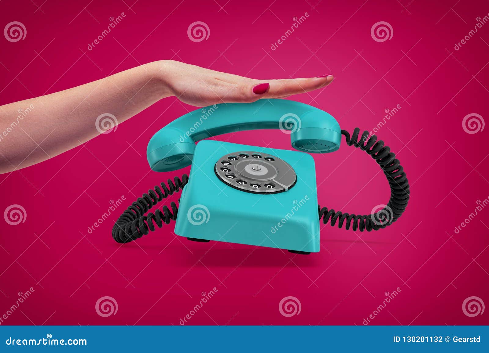 an elegant female hand presses down a handle of a retro blue rotary phone that rings and almost jumps up.
