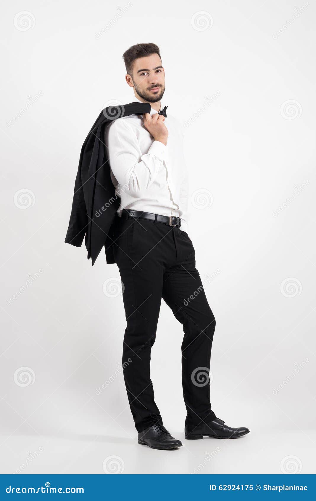 Elegant Man Holding Tuxedo Coat Over His Shoulder Looking at Camera Stock  Image - Image of body, camera: 62924175
