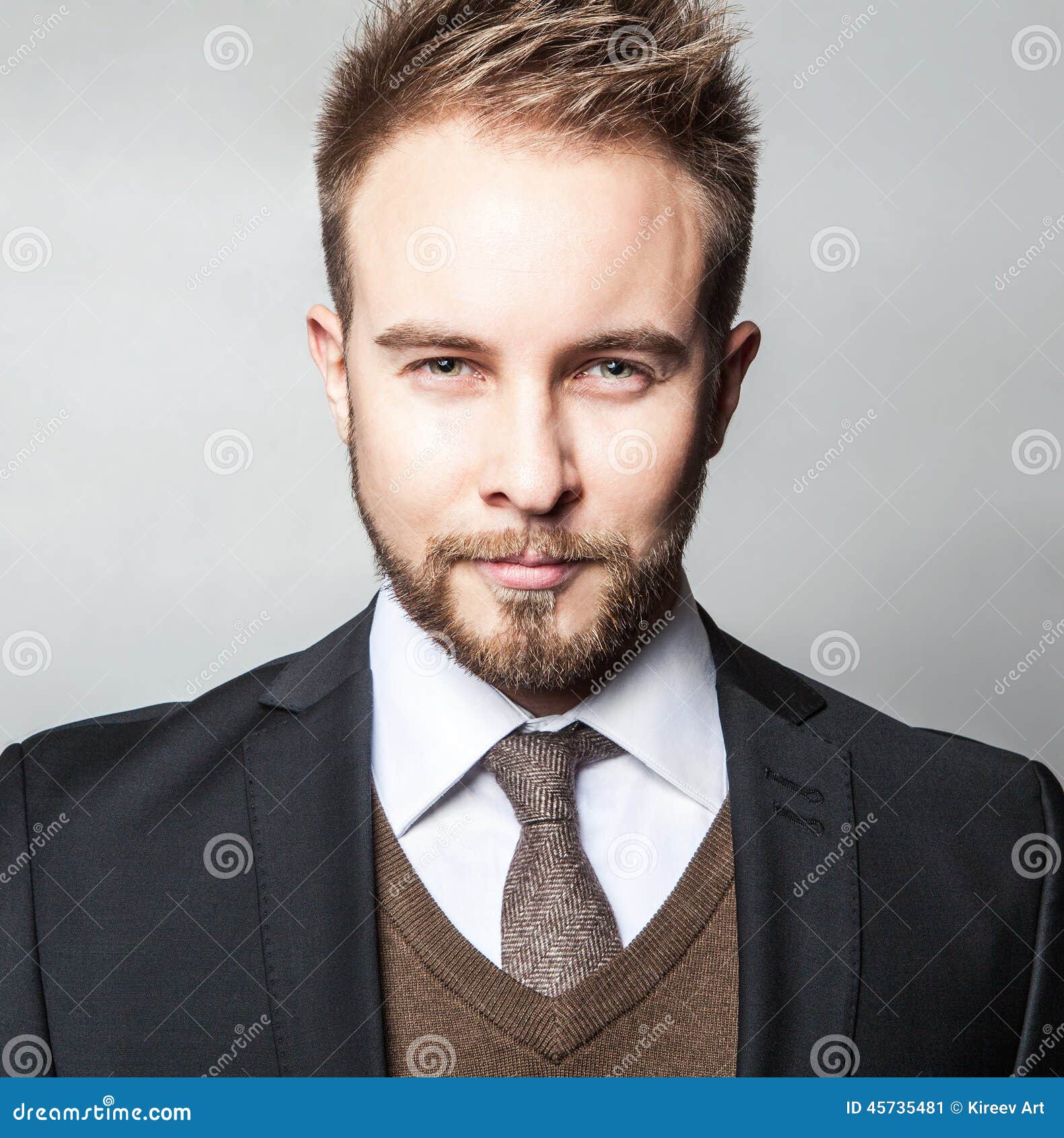 Elegant & Positive Young Handsome Man in Costume. Studio Fashion ...