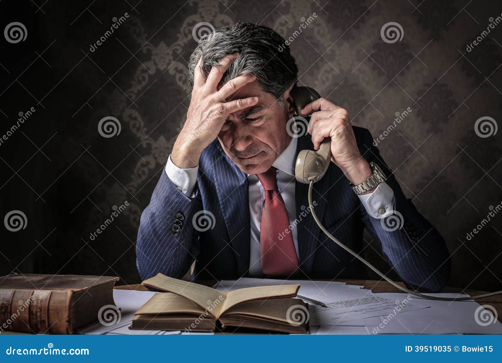 elegant rich businessman phoning