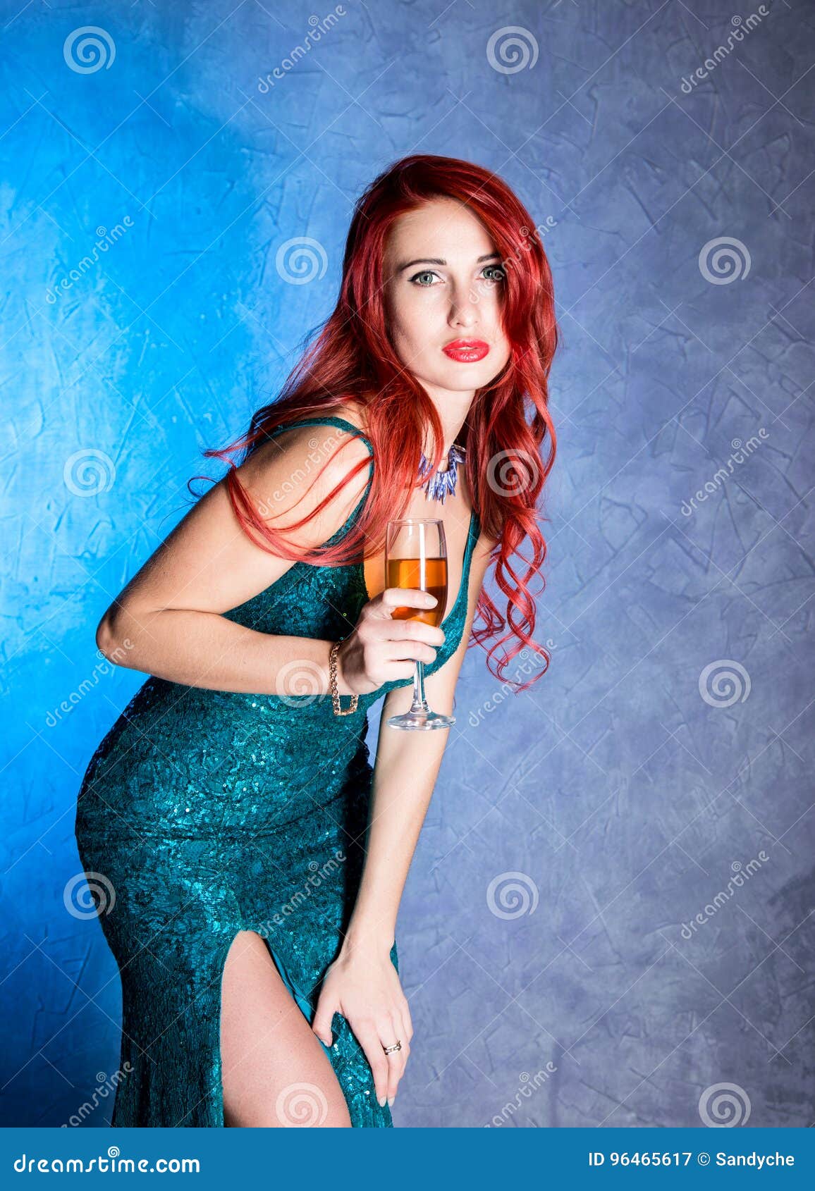 Elegant Woman with Big Boobs in Tight Blue Dress Holding Wineglass