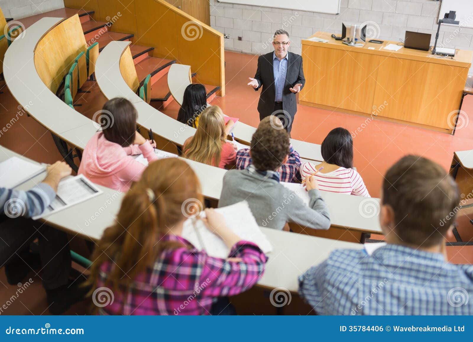 elegant teacher with students at the lecture hall