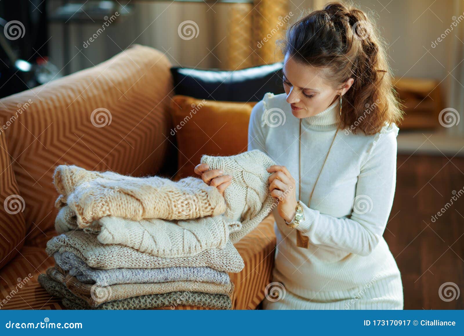 Elegant Woman Checking Sweaters for Damage Stock Image - Image of ...