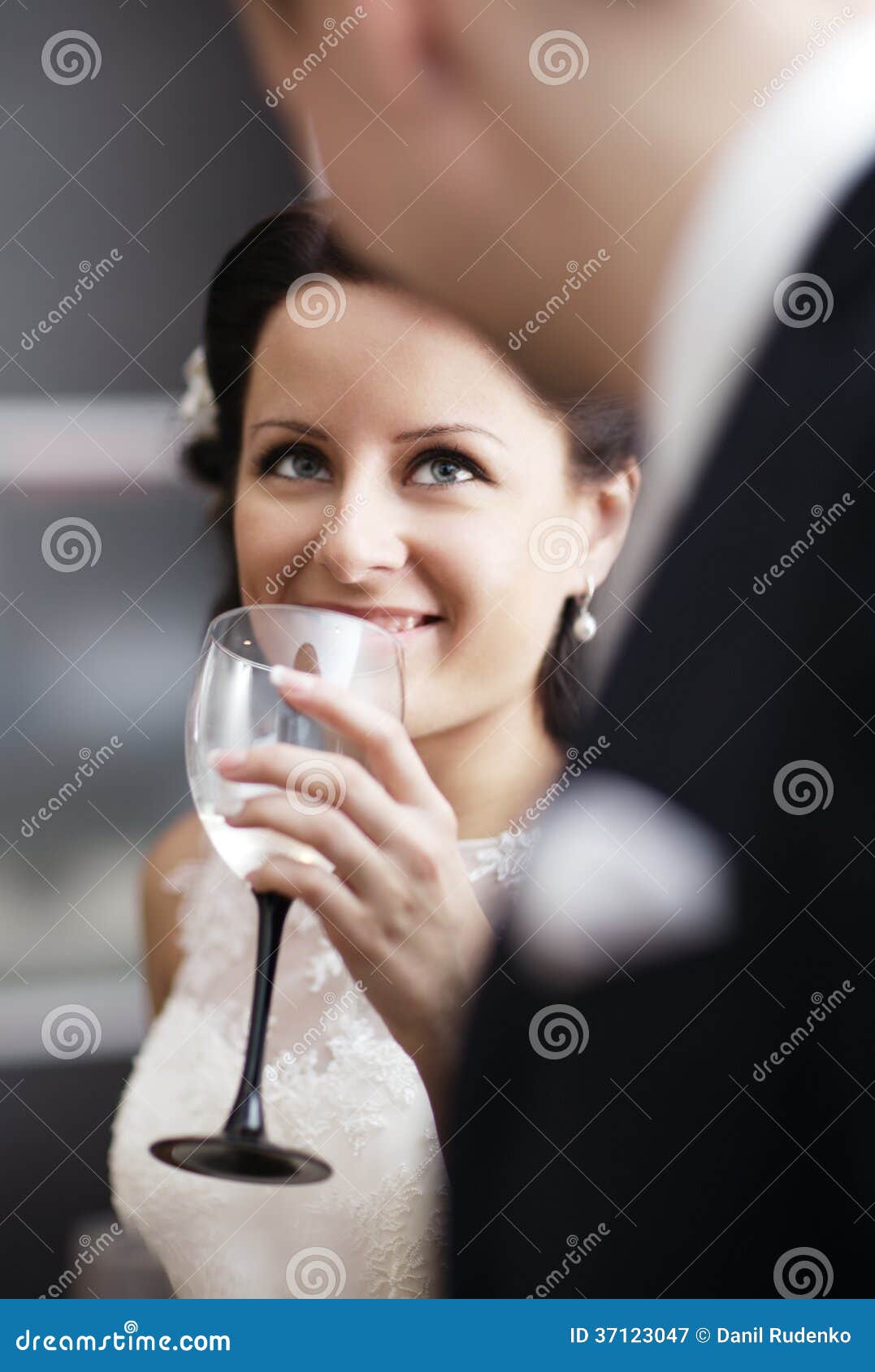 Businesswoman drinking from large wine glass with straw stock
