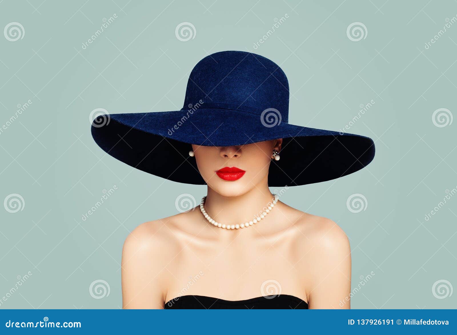 elegant woman fashion model with red lips makeup wearing classic hat and white pearls, portrait