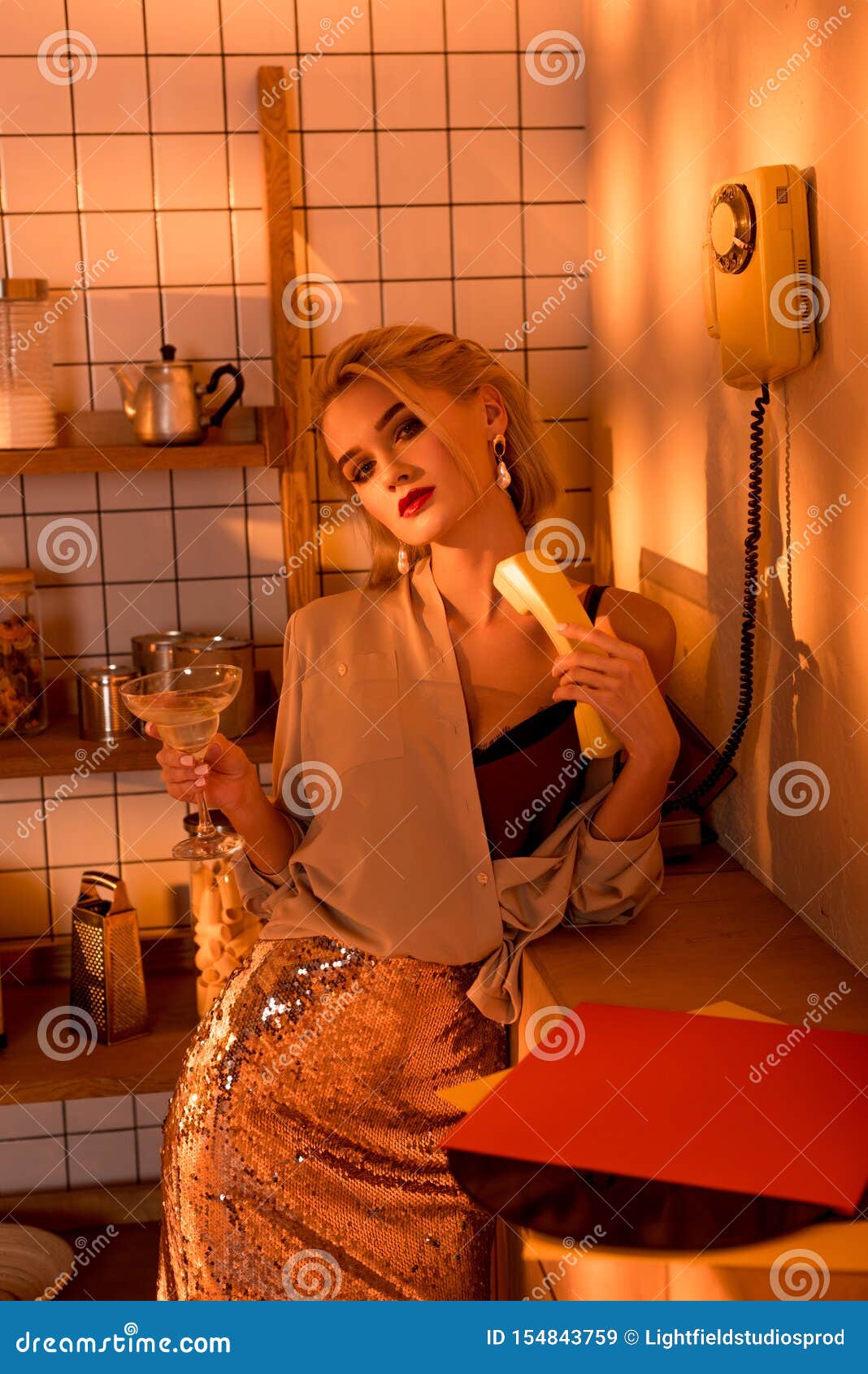 Elegant Woman Holding Retro Telephone with Cocktail and Looking at ...