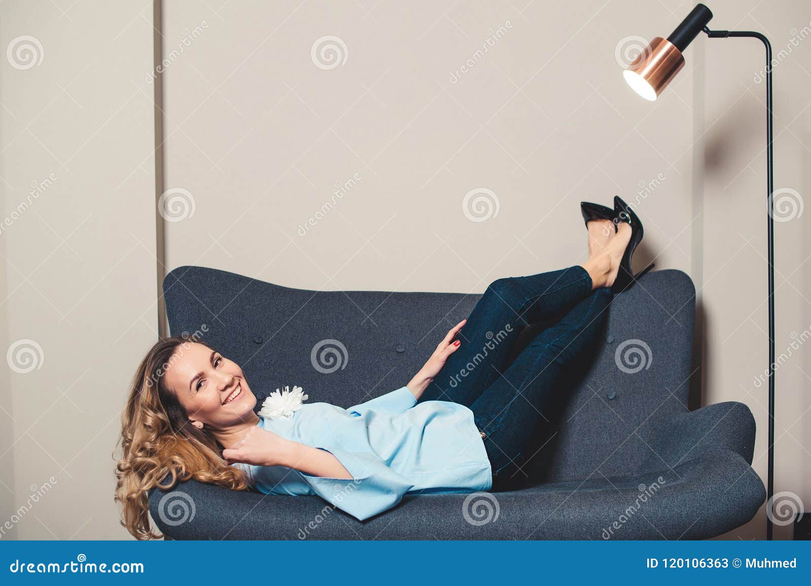 Elegant Woman Resting On The Couch In Stylish Shoes High Heels Young