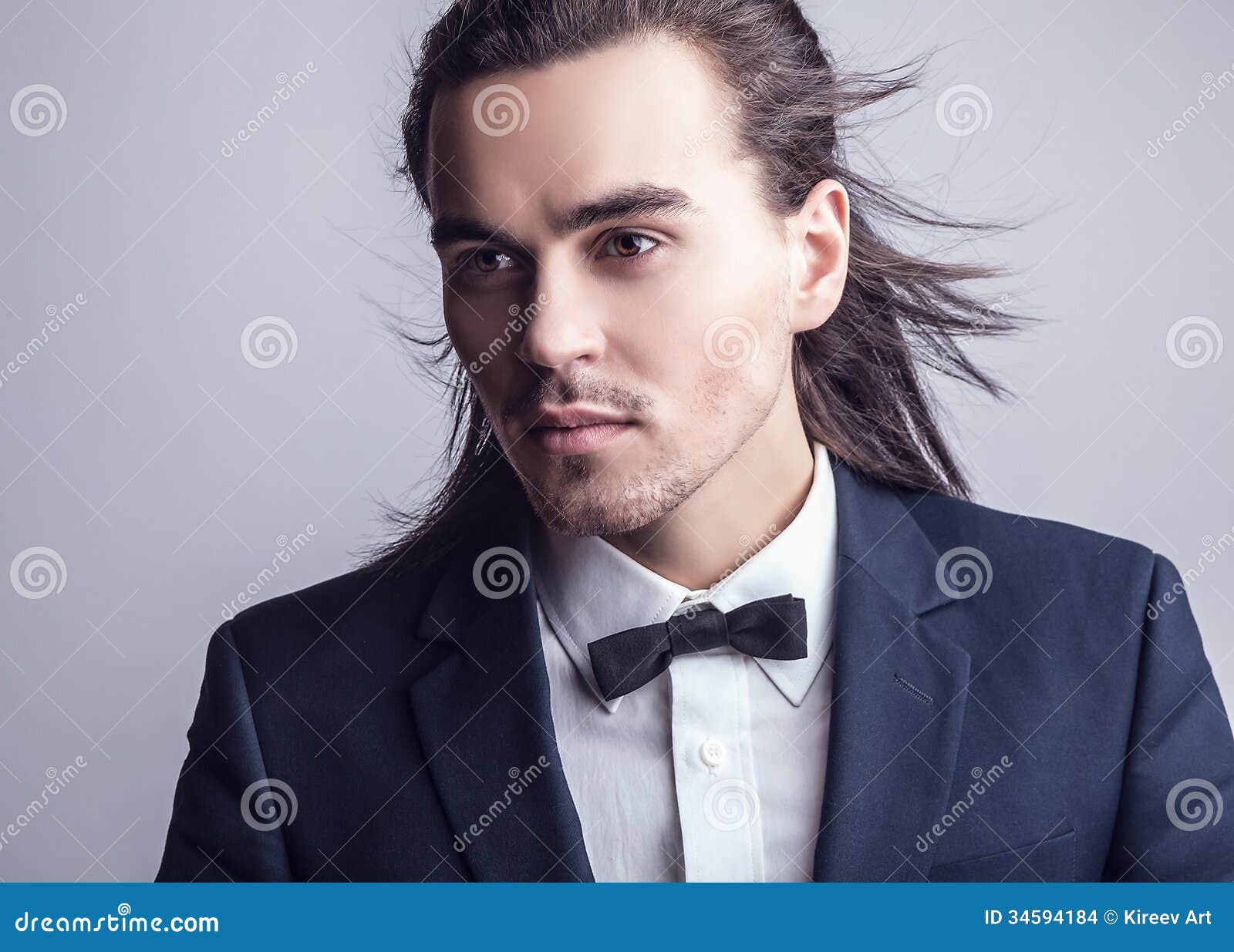 Elegant Young Handsome Long-haired Man in Costume. Stock Photo - Image ...