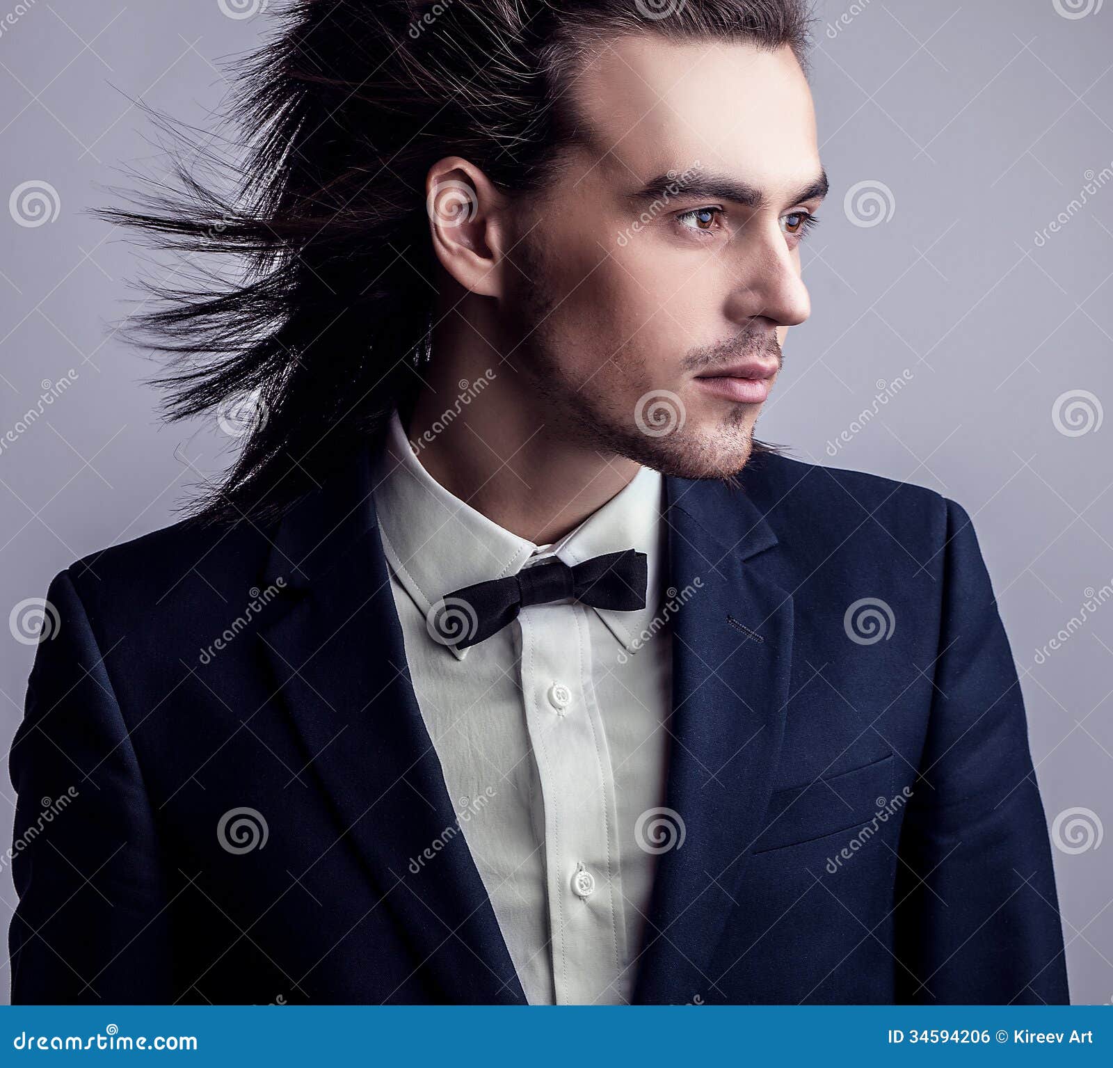 Elegant Young Handsome Long-haired Man in Costume. Stock Photo - Image ...