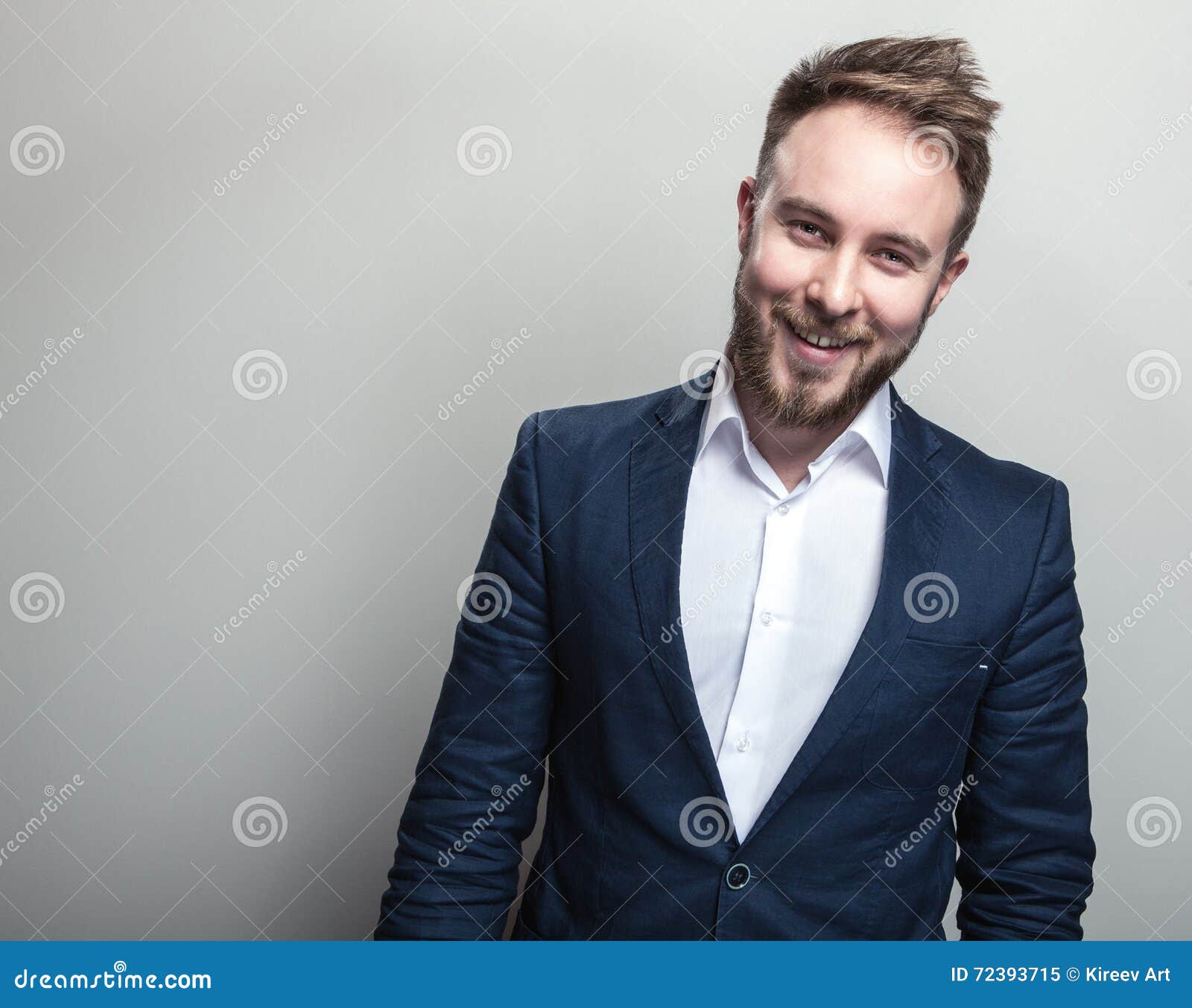 Elegant Young Handsome Man in Classic Dark Blue Costume. Studio Fashion ...