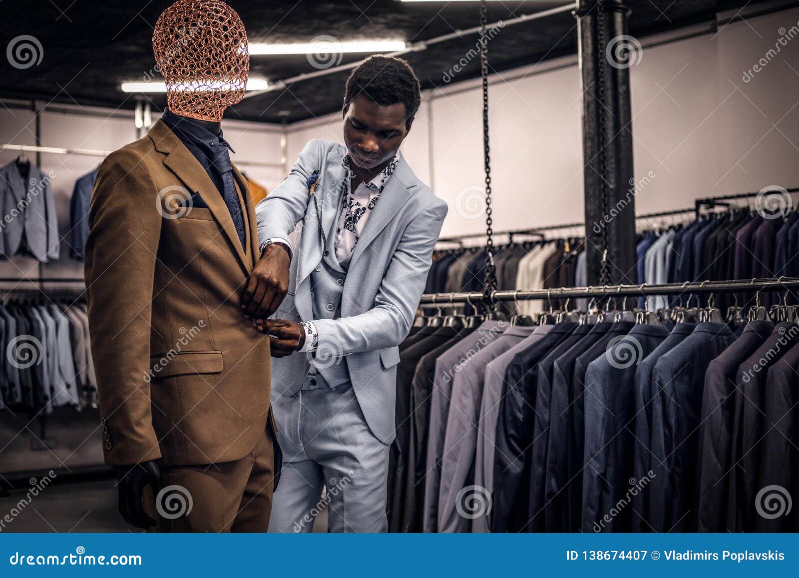 Elegantly Dressed African-American Man Working at Classic Menswear ...