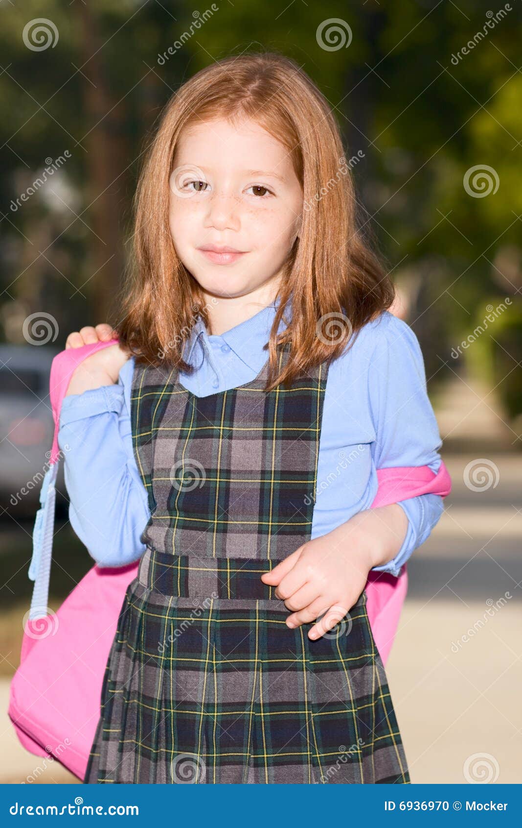 Elementary Age Schoolgirl In Uniform With Backpack Stock