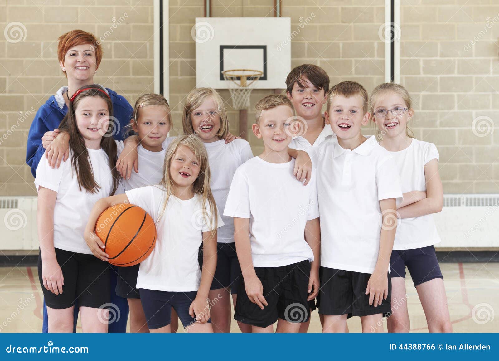 Elementary School Basketball Team with Coach Stock Photo Image of