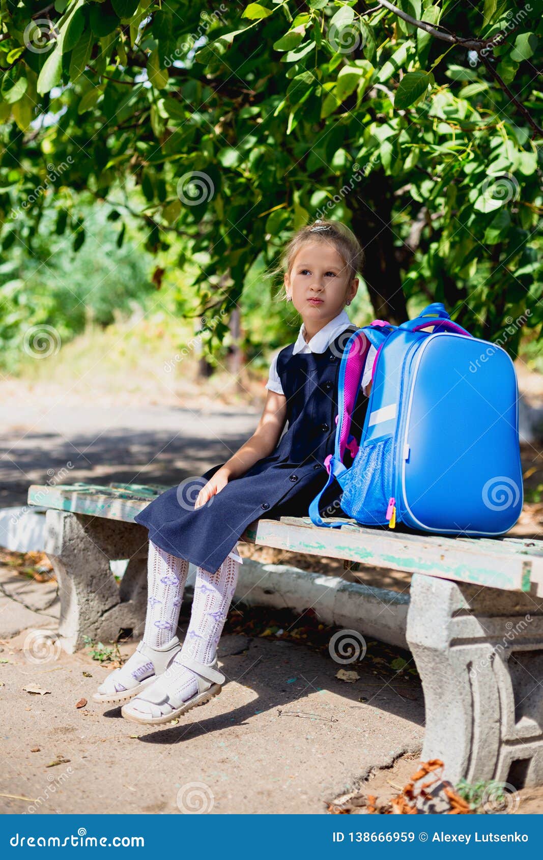 An Elementary School Student Sitting on a Bench Stock Image Image of