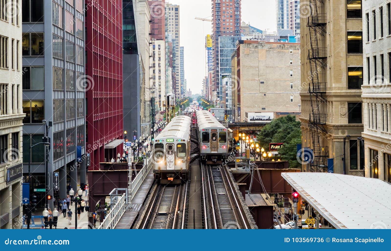 Elevated Train Tracks Above the Streets and between Buildings at the