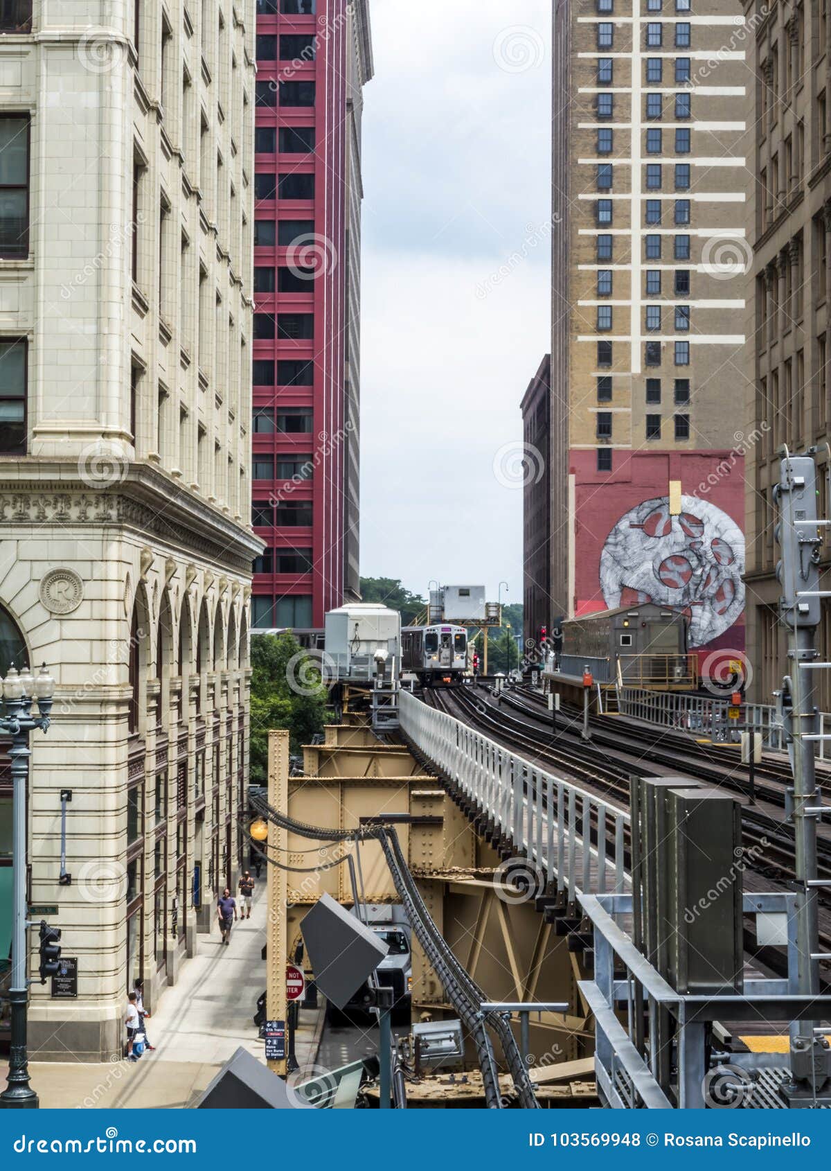 Elevated Train Tracks Above the Streets and between Buildings at the