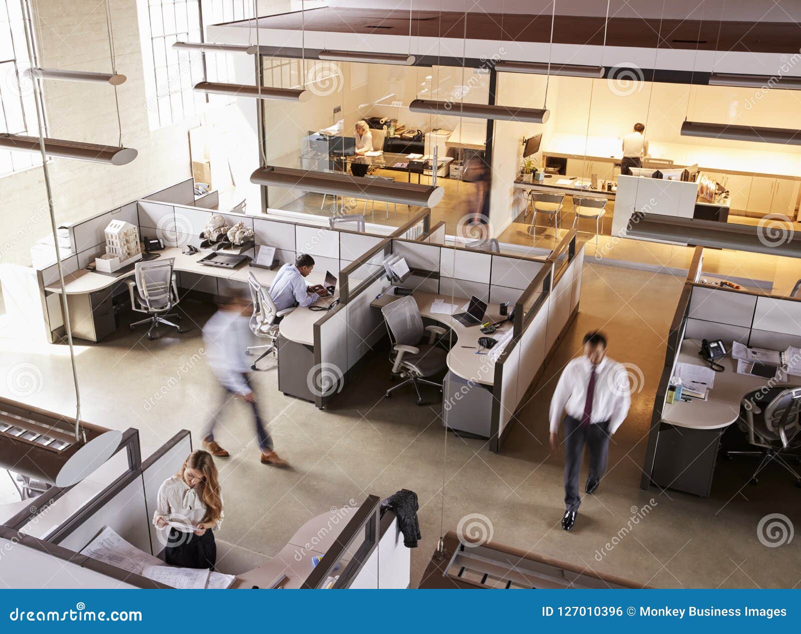 elevated view of staff working in a busy open plan office