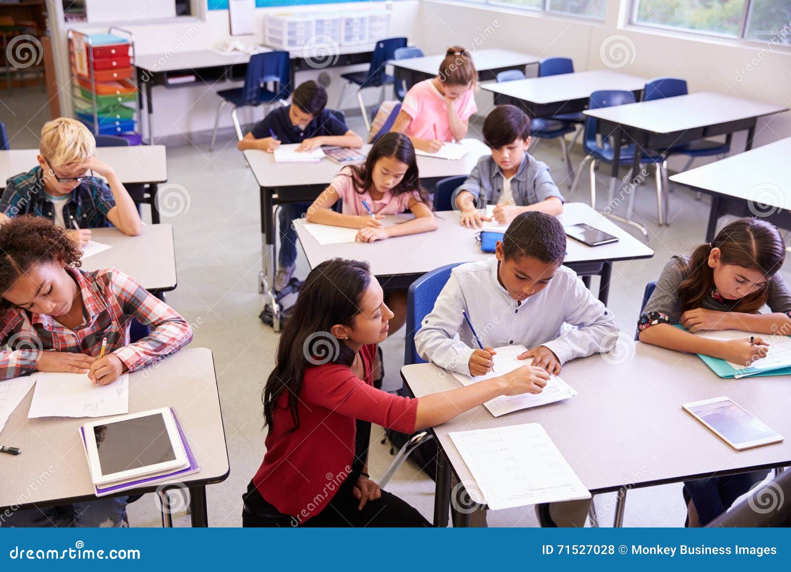 elevated view of teacher and class of ary school kids