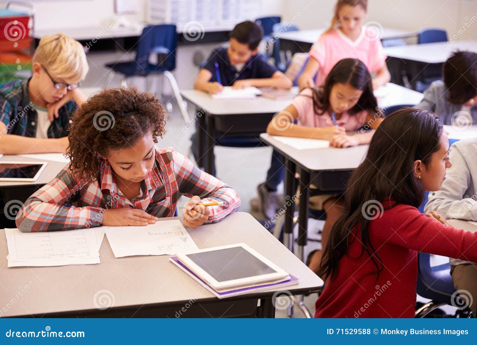 elevated view of teacher and kids in ary school class