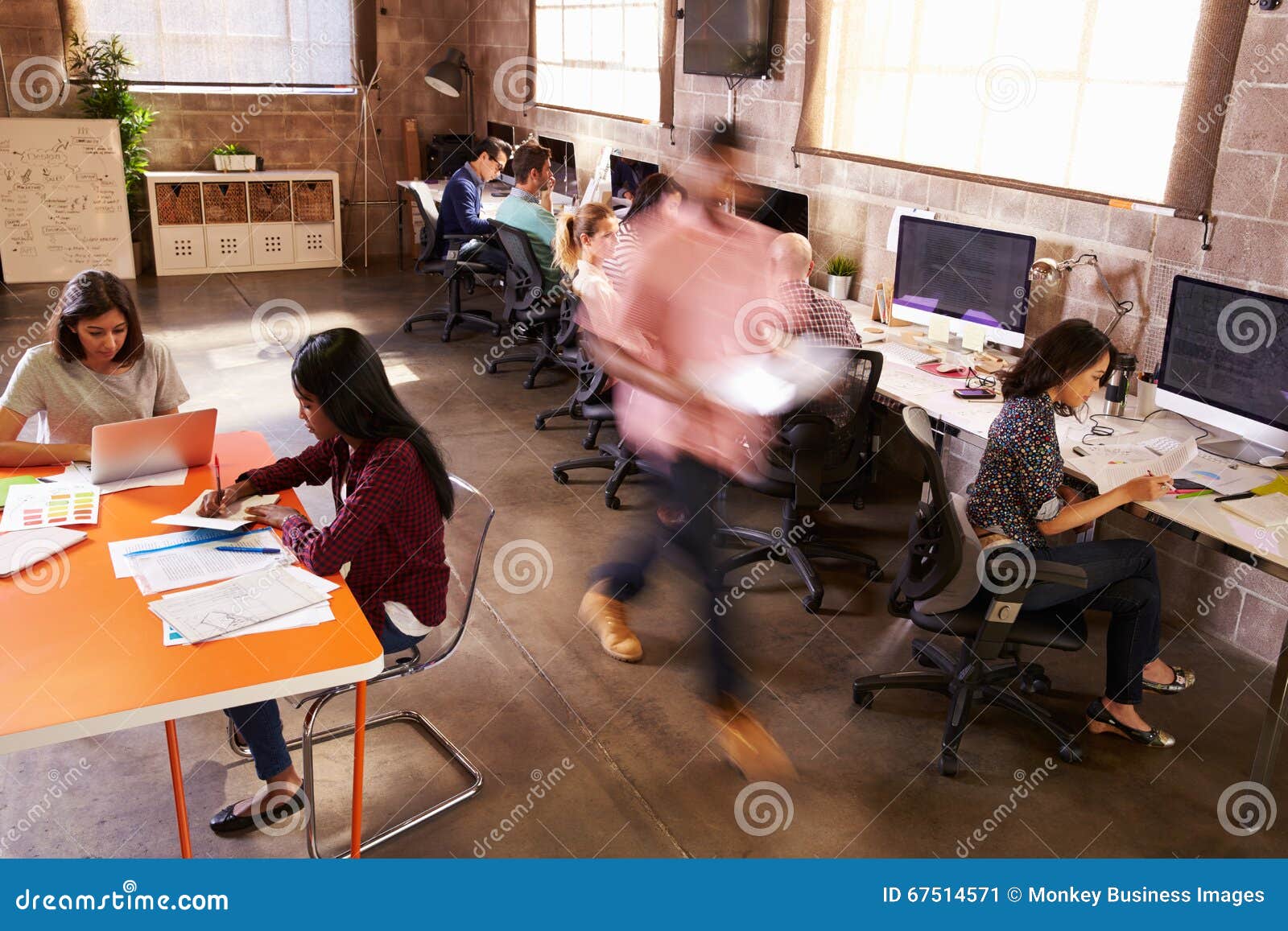 elevated view of workers in busy modern  office