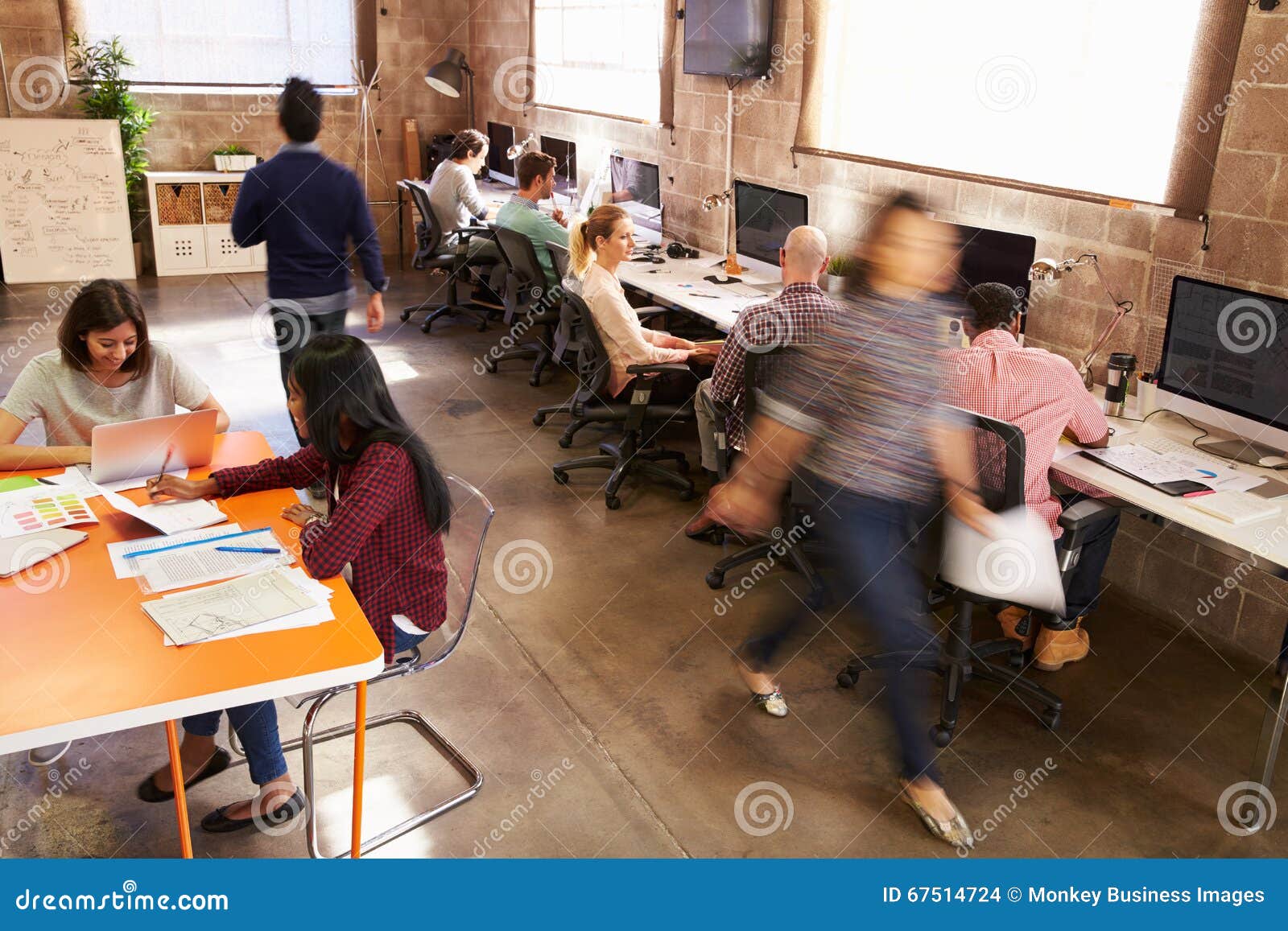 elevated view of workers in busy modern  office