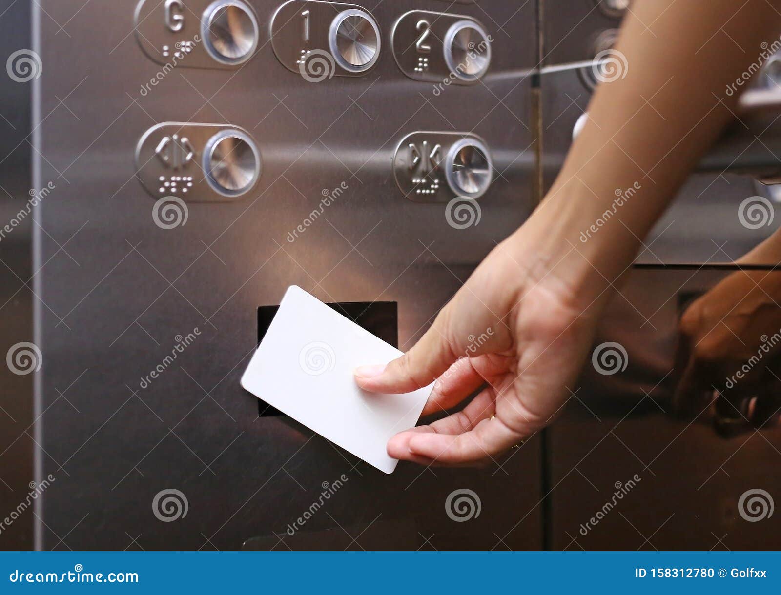 Elevator Access Control, Hand Holding a Key Card To Unlock Elevator