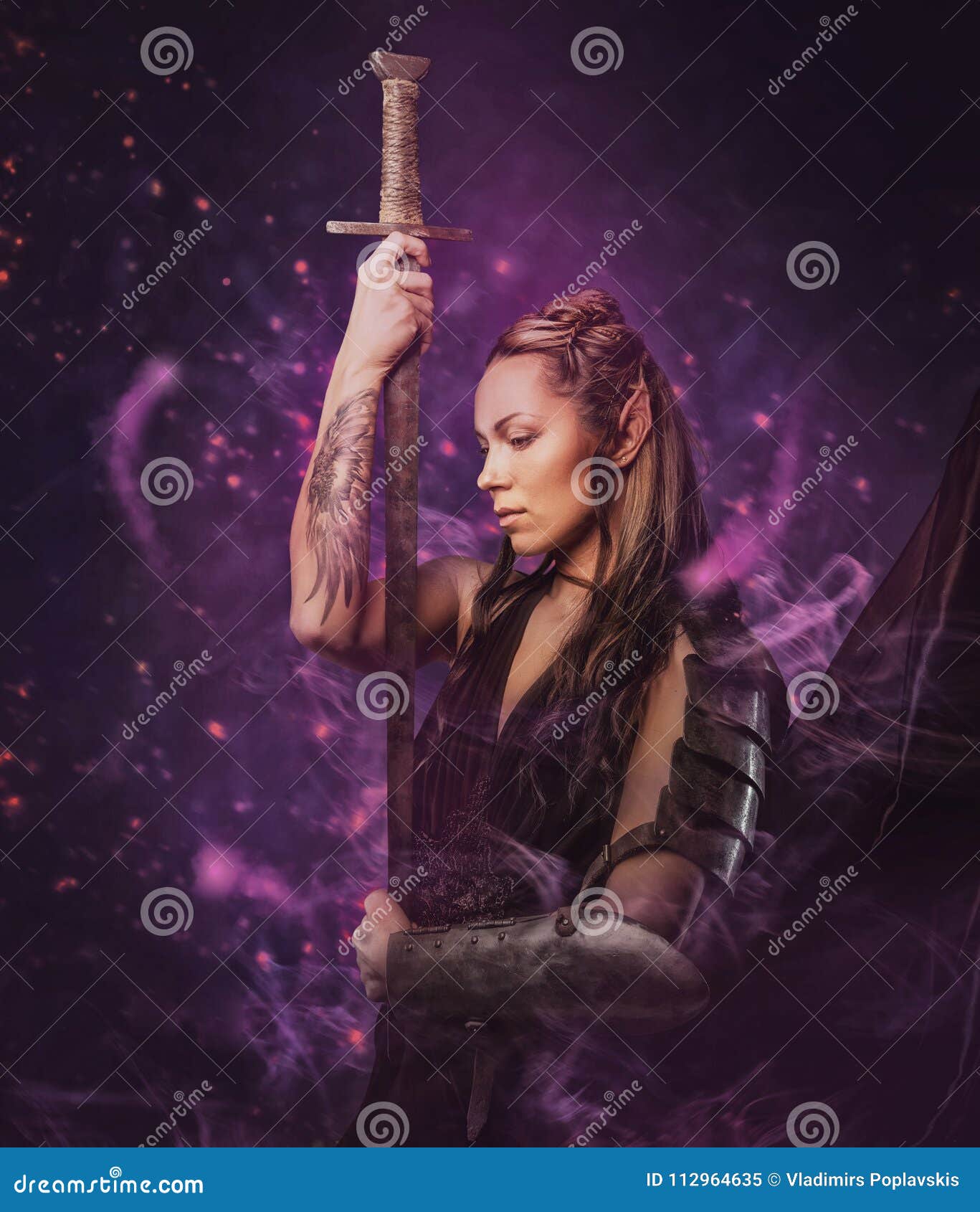 Premium Photo  A woman with a tattoo on her chest is holding a sword
