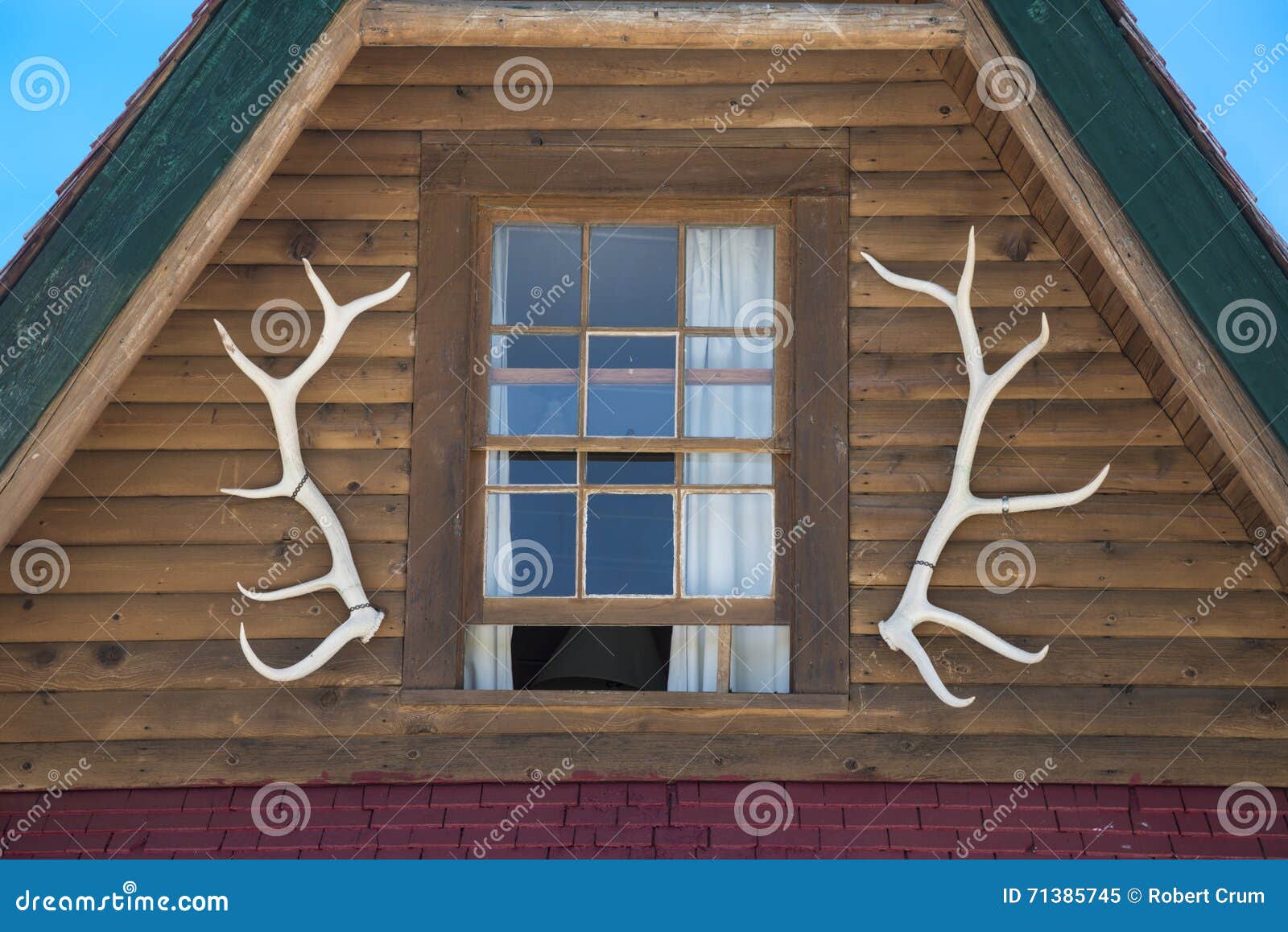 Elk antlers on log cabin stock image. Image of horizontal 71385745