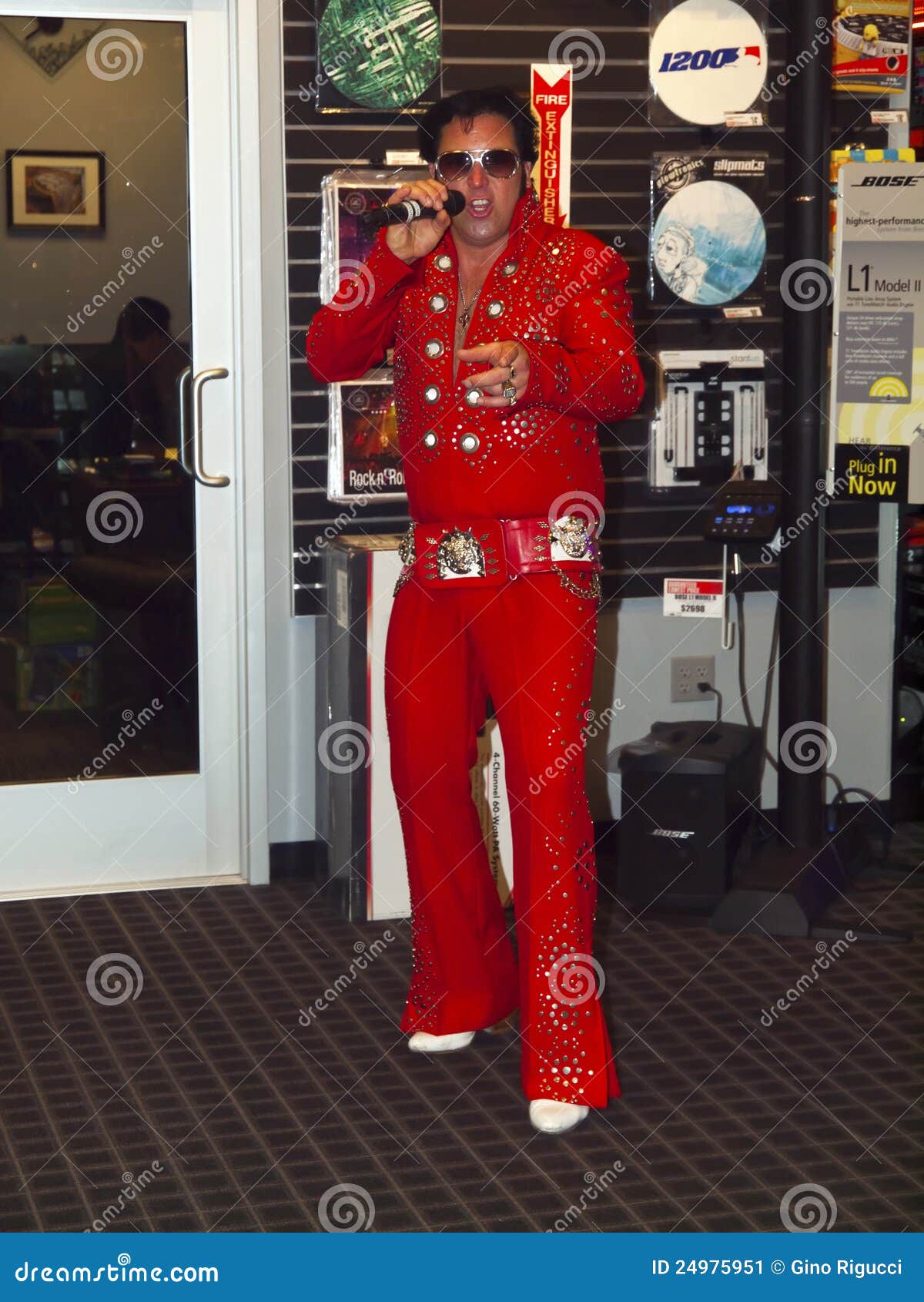Elvis Impersonator Singing at a New Store Opening Editorial Photo