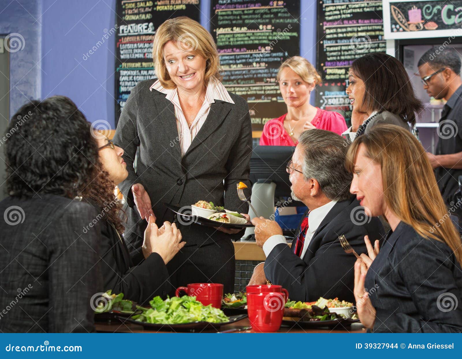 Embarrssed Cafe Owner. Embarrassed cafe manager with group of unsatisfied customers