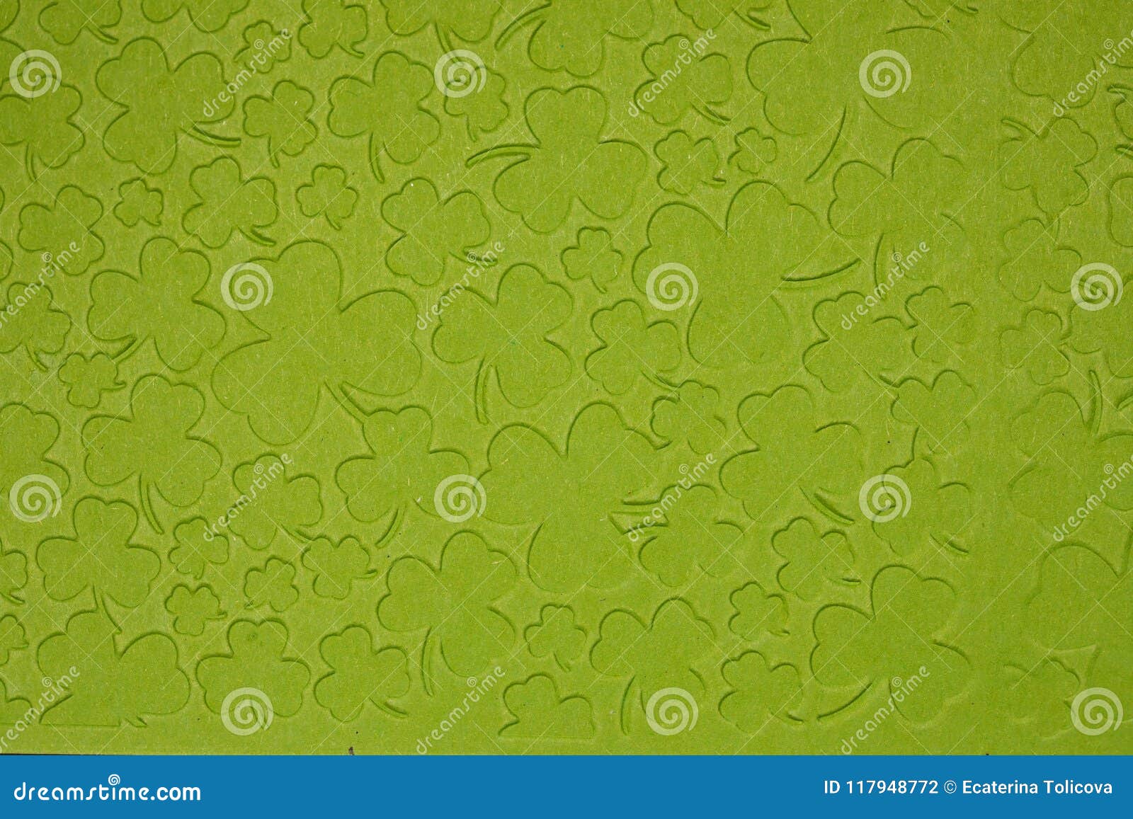 Embossed light green carton paper. Background of shamrock.