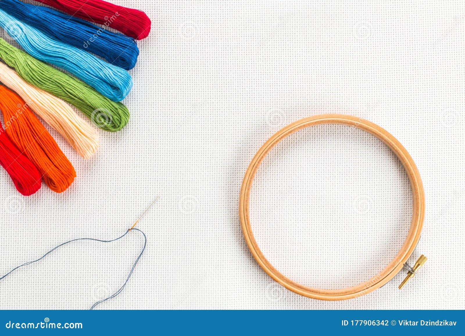 Embroidery Hoop, Needle and Different Color of Thread for Sewing Lying