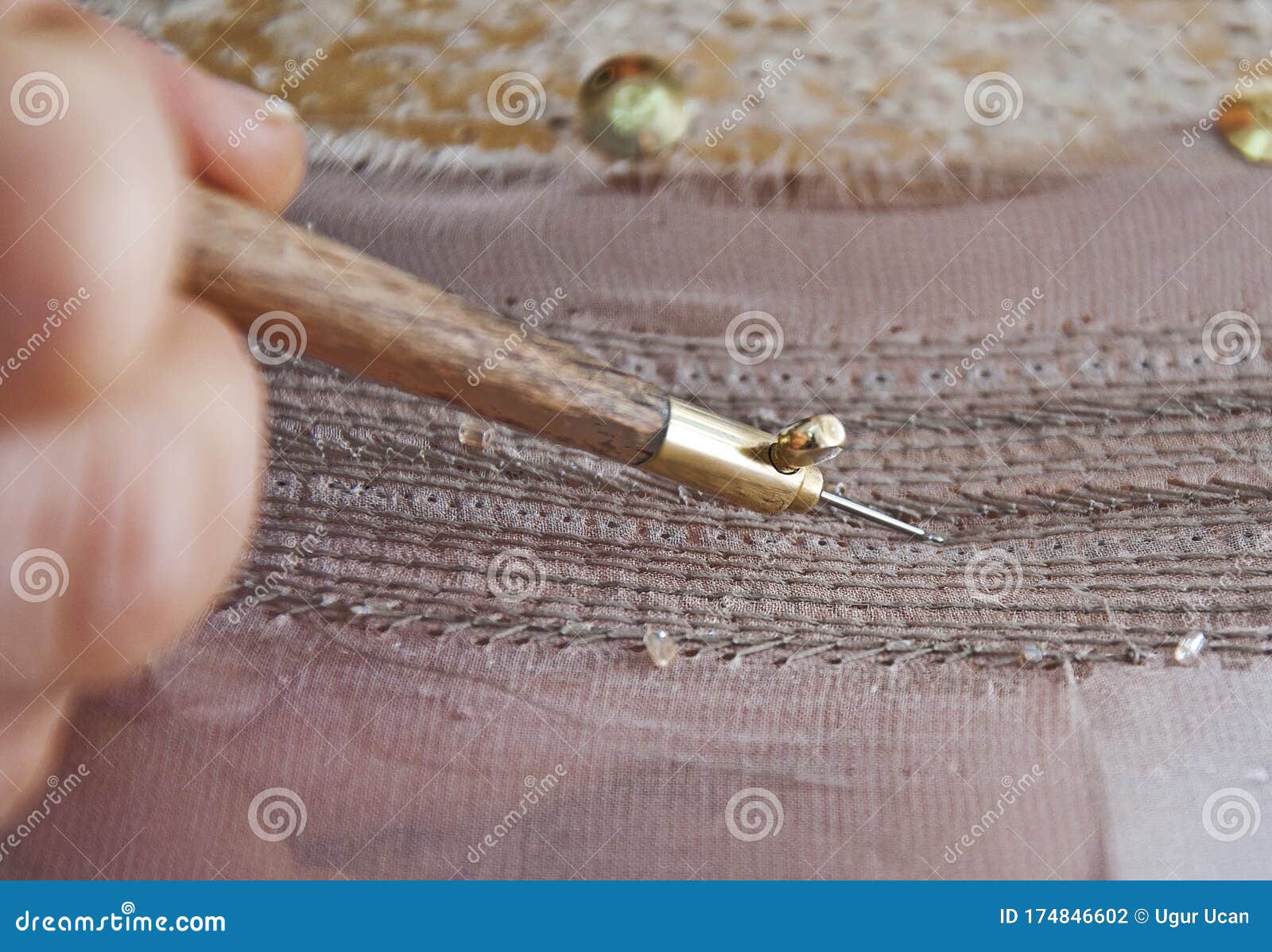 Embroidery and Needlework Patterns for Handmade Dresses Made Using Embroidery Needle Stock Photo