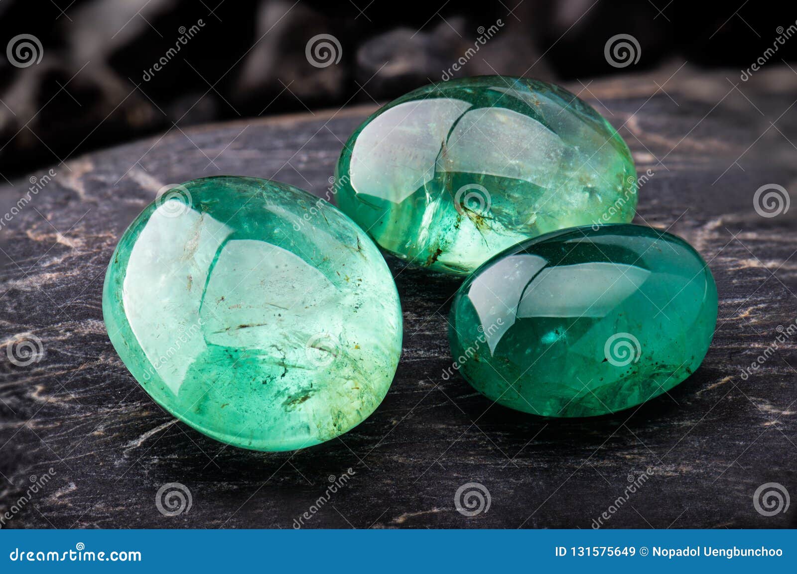 The Emerald Gemstone Jewelry Photo with Black Stones and Dark Lighting  Stock Image - Image of crystals, jewelry: 131575649