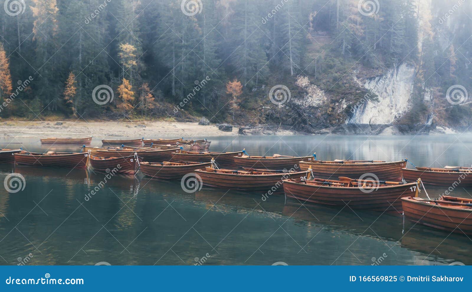 emerald waters of lago di braies and wooden boats