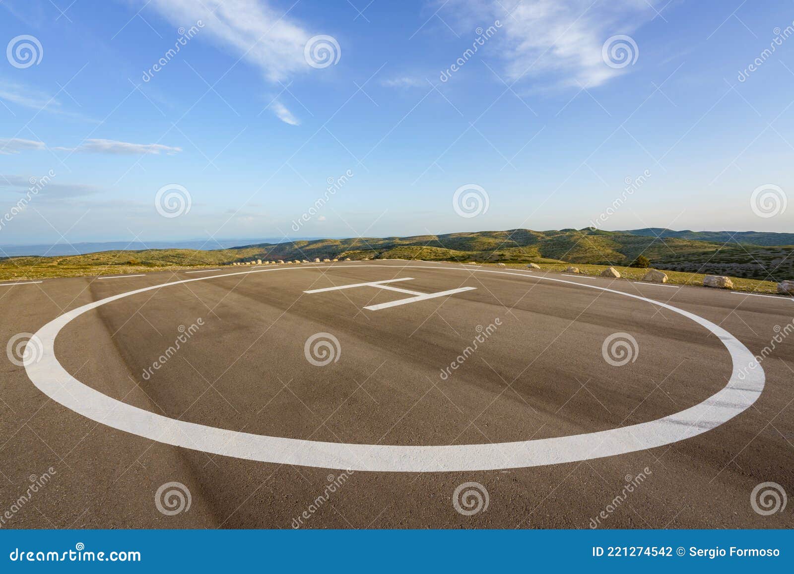 empty helipad on top of a peak in a countryside remote location