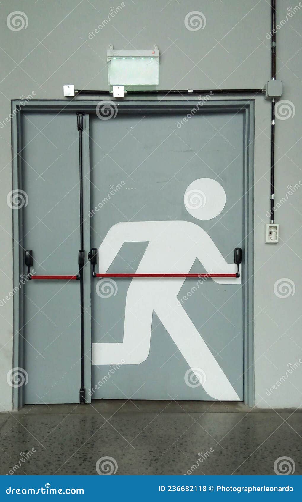 emergency exit door with running person graphic