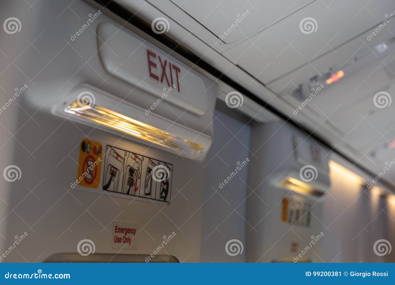 Emergency Exit And Light In Aircraft Cabin Stock Image Image of seating, economy 99200381