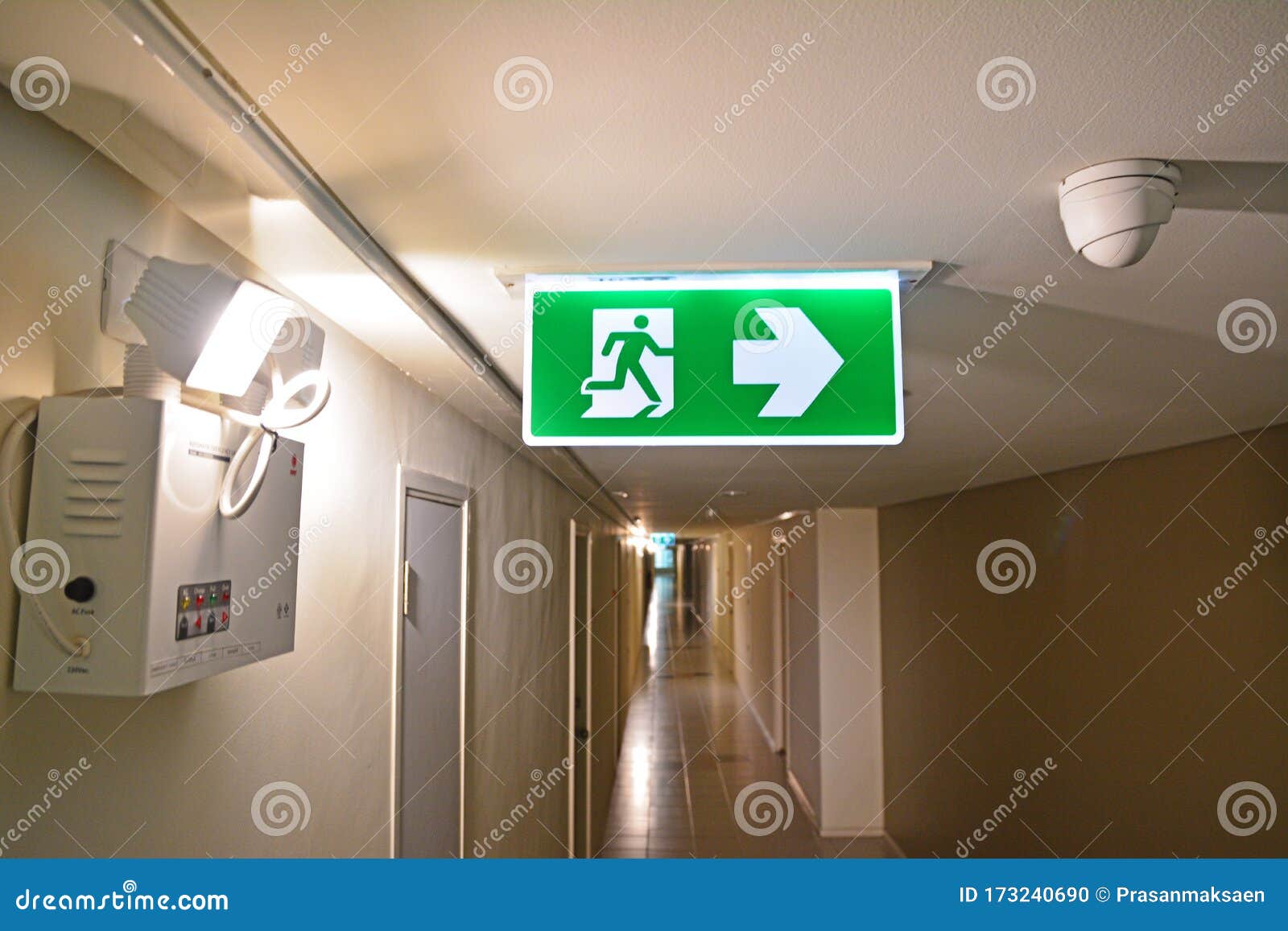 Emergency Light and Emergency Fire Exit Sign at the Corridor Stock