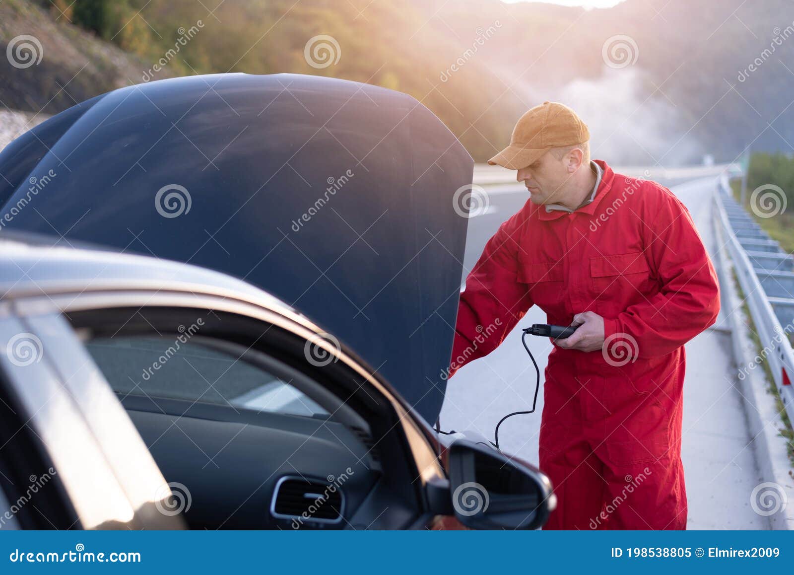 Emergency Roadside Assistance, Road Assistance Worker in Uniform Trying
