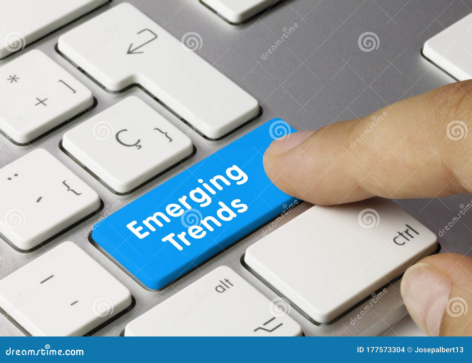 emerging trends - inscription on blue keyboard key