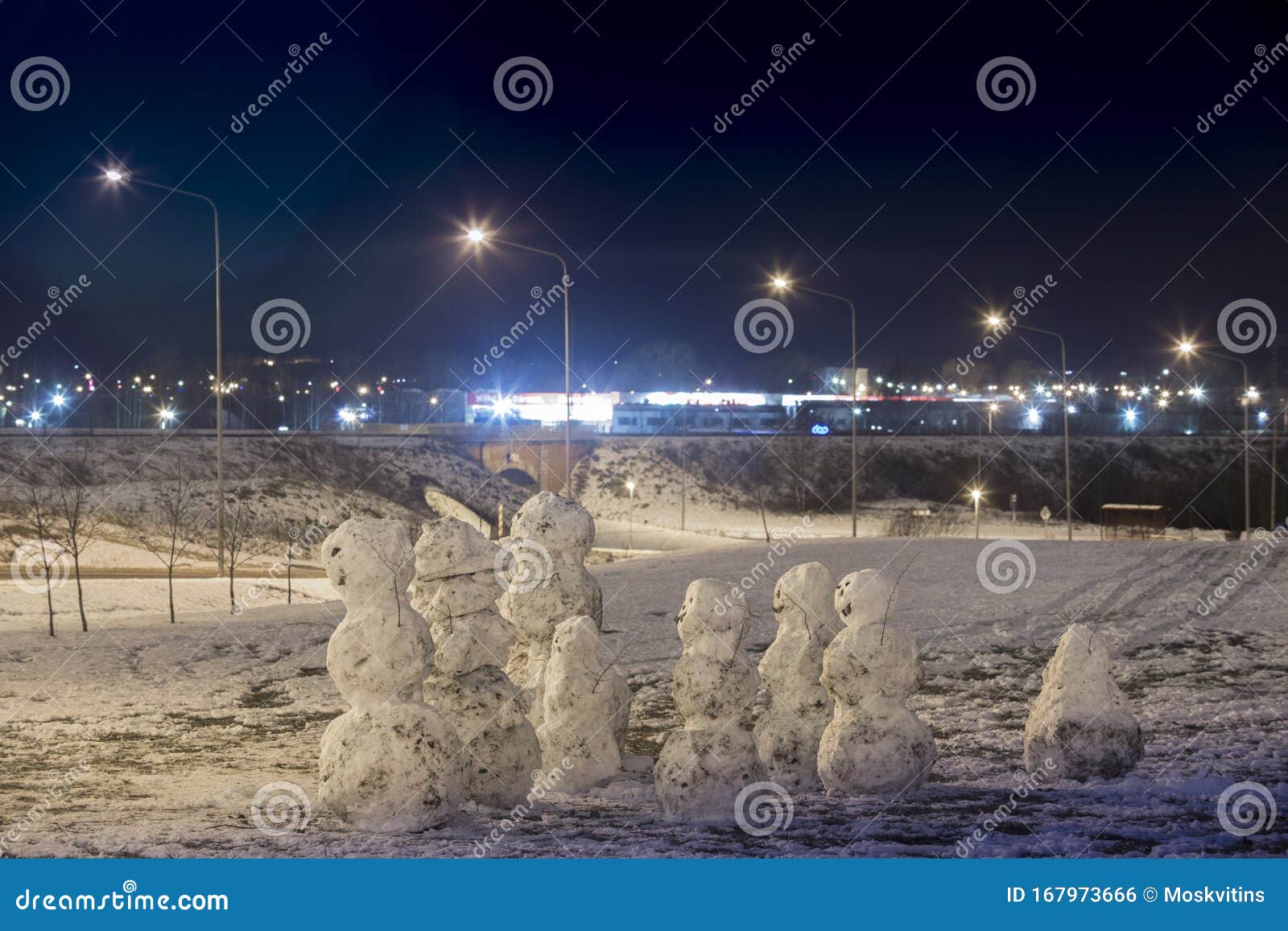 emocional snowman`s family at december night